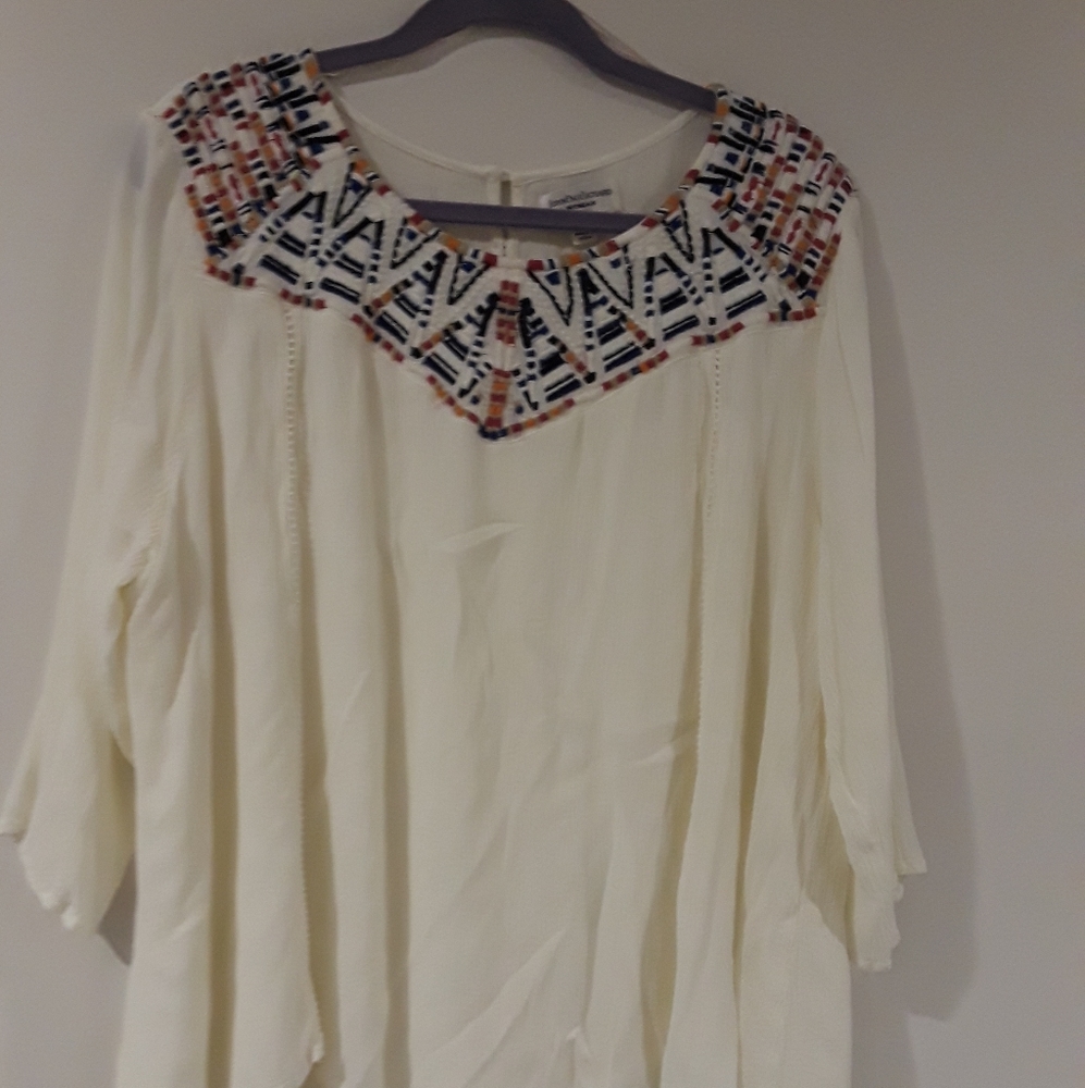 White flowy top with rainbow stitched collar